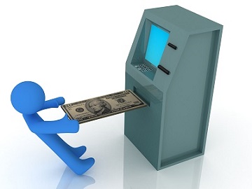 man depositing money into ATM